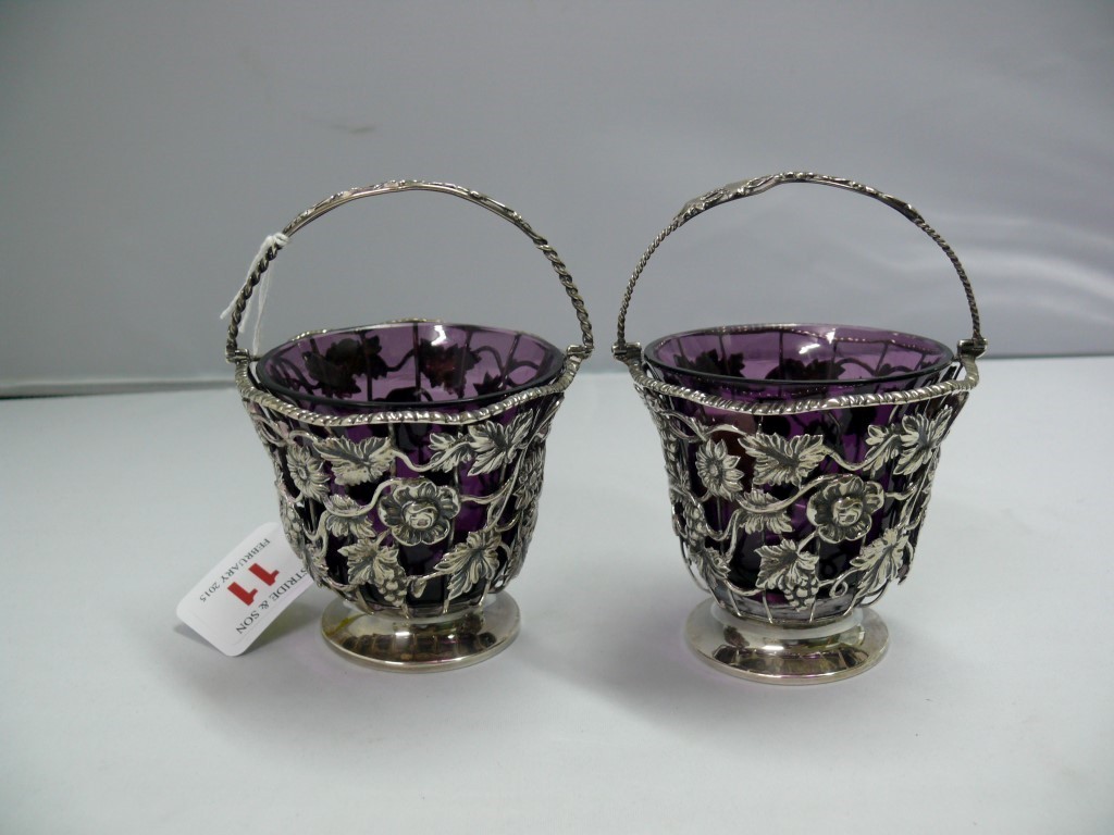 A pair of silver floral wirework baskets, by Hancock's, Bruton Street, London 1912, having