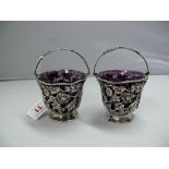 A pair of silver floral wirework baskets, by Hancock's, Bruton Street, London 1912, having