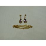 A pair of 9ct gold amethyst pendant earr