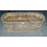 An antique lead oval planter, 77cm wide.