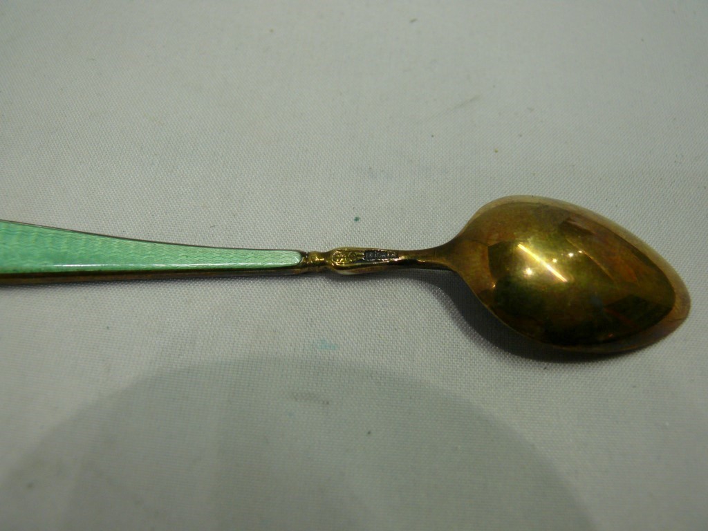 A cased set of six silver gilt and polychrome enamel coffee spoons, Birmingham 1960. Condition - Image 5 of 5