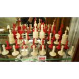 An antique English ivory chess set, red