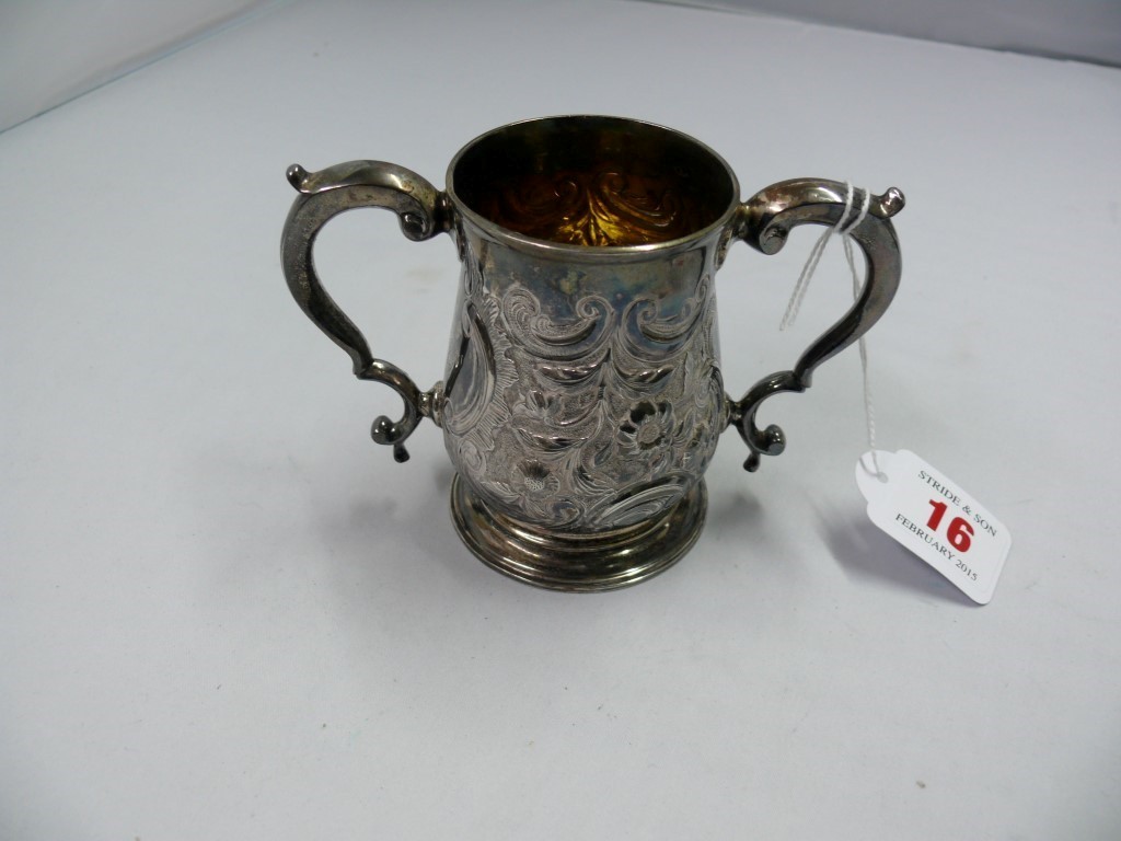 A metal twin handled cup, 9cm.