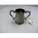 A metal twin handled cup, 9cm.