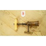 A 19th century Thomason type brass and turned ivory rack corkscrew. Condition Report: The barrel