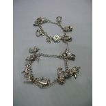 Two silver charm bracelets, having eight