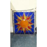 An antique stained and leaded glass star