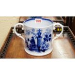 A Victorian blue and white pottery loving cup, printed with the Ameer pattern, 12.5cm high.