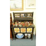 An Arts & Crafts ebonized and parcel gilt side cabinet, stamped 'Snowdon, Rochdale', the mirrored