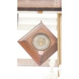 An oak framed aneroid barometer, with si