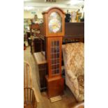 A reproduction teak veneered longcase cl