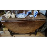 An early 18th century oak gateleg table,