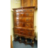 An 18th century walnut and featherbanded chest on stand, 107cm wide.  Condition Report: Overall