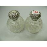 A pair of spherical cut glass scent bott