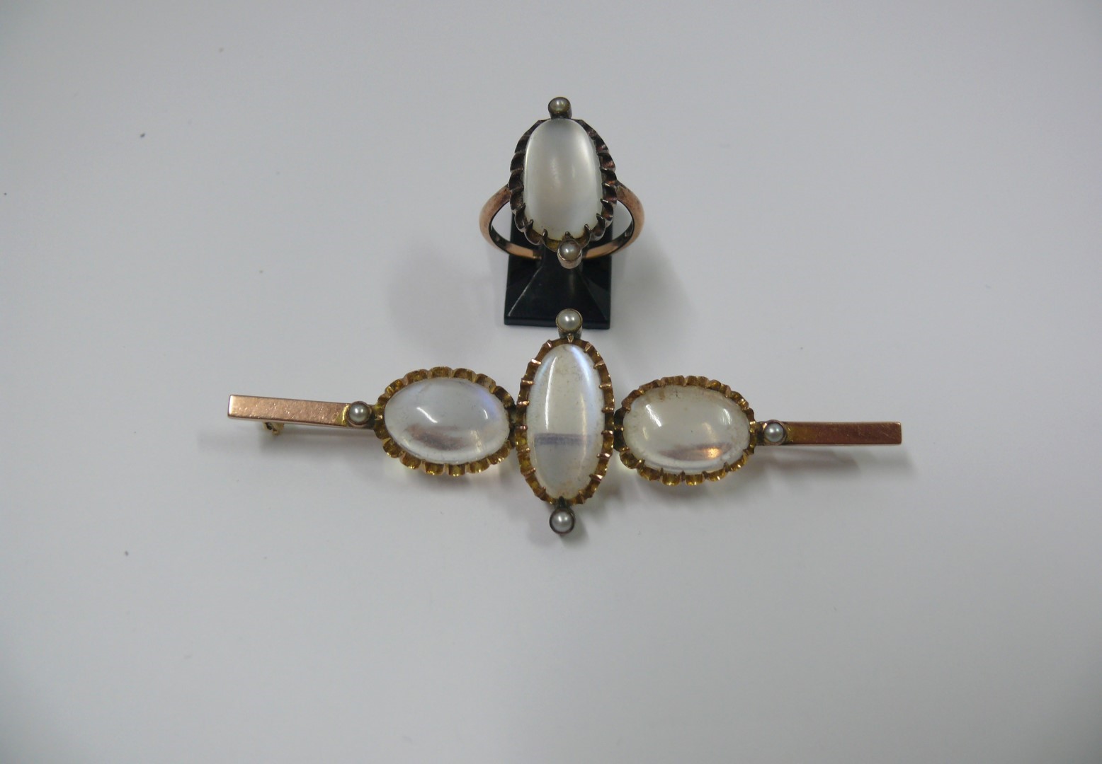 A 9ct gold bar brooch set three oval moo - Image 2 of 3