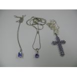 A 9k white gold cross set tanzanite, wit