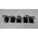 Five various 9k gold and tanzanite set r