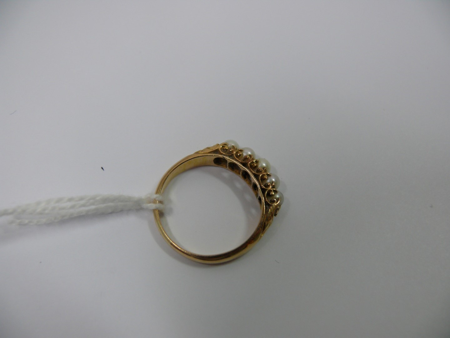 An unmarked gold ring set five inline pe - Image 2 of 3