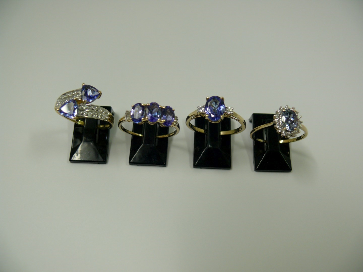 A selection of four 10k gold rings set t