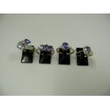 A selection of four 10k gold rings set t