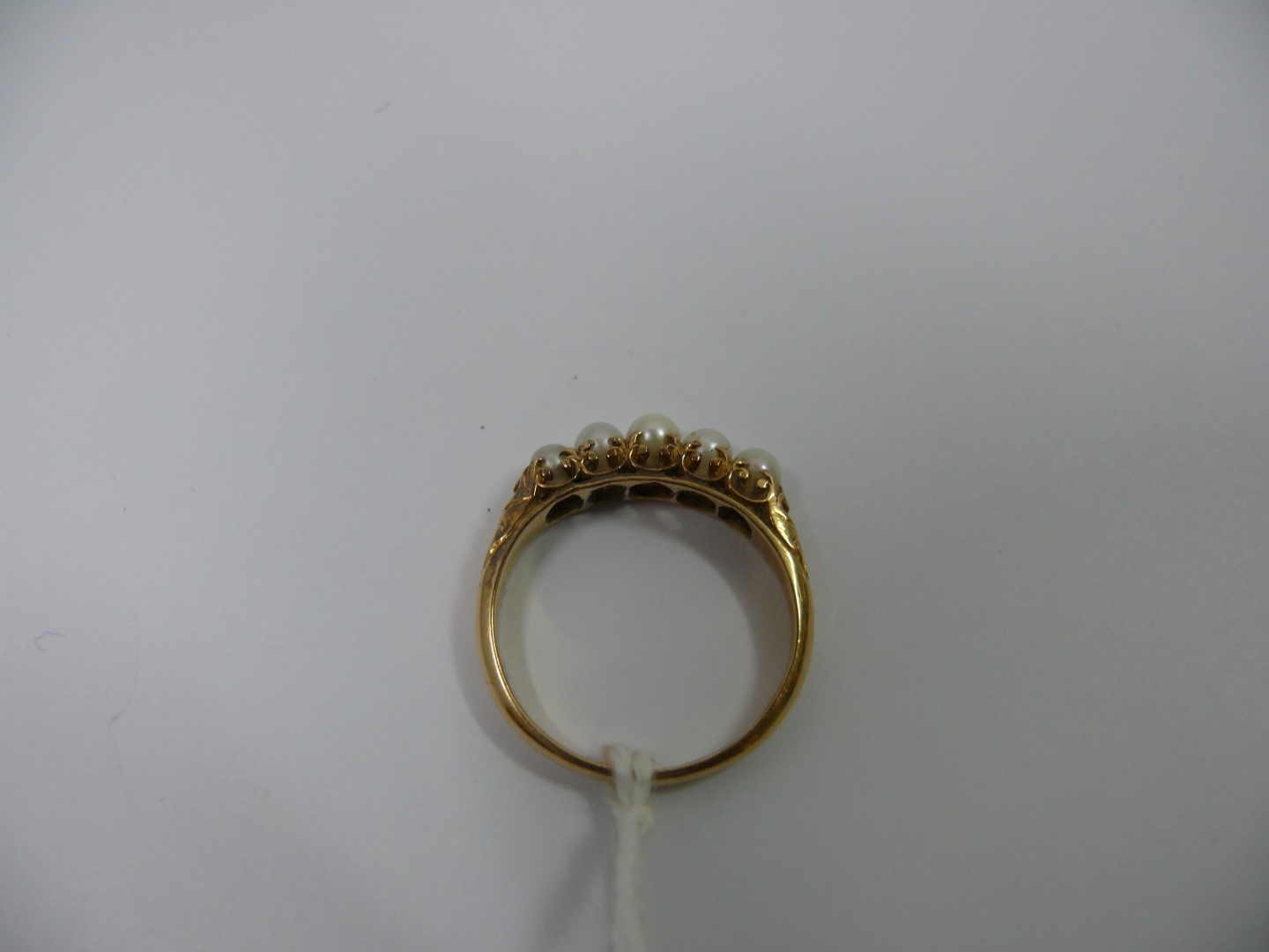An unmarked gold ring set five inline pe - Image 3 of 3