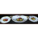 A good KPM fruit painted twin handled lozenge dish and two matching plates, the dish 28cm wide.