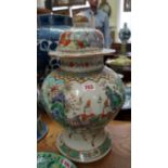 A Chinese famille verte inverted baluster vase and cover, Kangxi four character mark, painted with