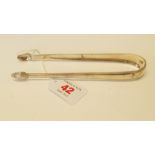 A pair of Irish George III silver sugar tongs, by Benjamin Taitt, circa 1790, 37g, 15.5cm. Condition