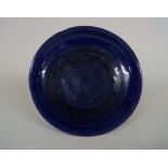 A rare Chinese aubergine glazed dragon dish, six character kangxi mark and probably of the period,