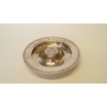 A silver circular ashtray, by Garrard & Co Ltd, London 1997,
