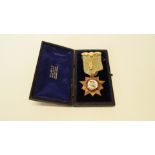 An 18ct gold and coloured enamel masonic medal,