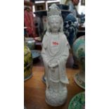 A Chinese blanc de chine figure of Guanyin, 43cm high, (chips to fingers and head-dress).