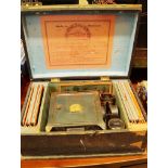 An early 20th century German magic lantern and set of slides, in original fitted box, 29.5cm wide.