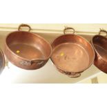 Two Victorian copper preserving pans, one by Benham & Froud, largest 48.5cm wide including handles.