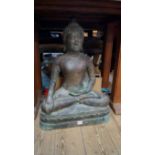 A bronze buddha, seated with left palm up, 71.5cm high.