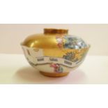 A Chinese bowl and cover, Jiaqing seal mark, painted in famille rose with figures in a continuous