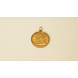 An Edward VII 1907 sovereign, in a 9ct gold mount.