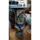 A Chinese famille verte rouleau vase, Kangxi four character mark, painted with shaped panels of