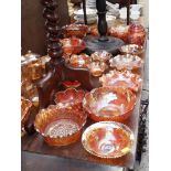 A large quantity of orange carnival glass.