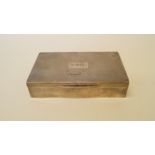 A silver engine turned cigarette box, by Mappin & Webb, Birmingham 1938, initialled T.C.M, cedar