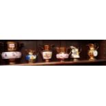 Five 19th century copper lustre jugs,