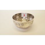 A colonial white metal cylindrical sugar bowl, inscribed 'Arlington & Co, Calcuta', decorated tiger,