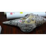 A Tibetan Buddhist conch shell and white metal mounted blowing horn, embossed with animal figures,