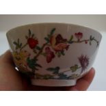 A Chinese famille rose bowl, Daoguang seal mark, painted with a pomegranate and flowering branches,