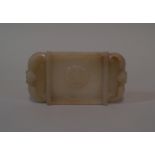 A Chinese carved pale celadon jade twin handled brush washer, of rectangular form, relief carved