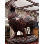 A carved and painted wood cockerel, 42cm high.