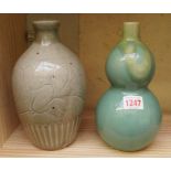 An Oriental double gourd vase, 21cm high; and another Chinese vase.