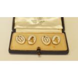 A cased pair of 18ct gold and white enamel cufflinks, 12.5g total weight.