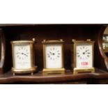 Three brass carriage timepieces, to include: an oval example, the dial inscribed 'Charles Frodsham',