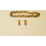 A 15ct gold link bracelet, 8g, together with a pair of metal ear studs.